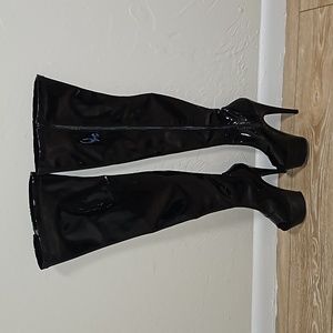 Black patented leather peep toe high above knee boots